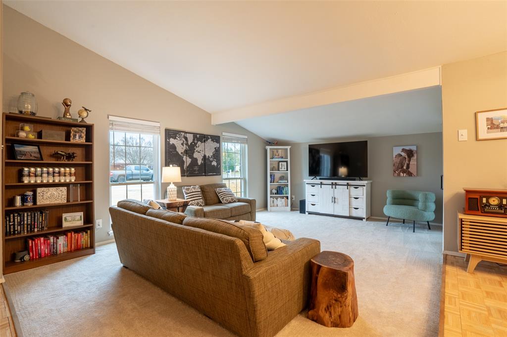 3124 Barton Road Carrollton, TX 75007 - Photo 4 of 36 a living room with furniture workspace and a flat screen tv