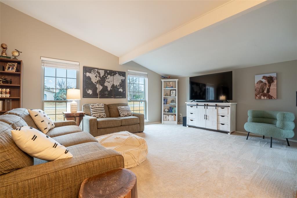 3124 Barton Road Carrollton, TX 75007 - Photo 6 of 36 a living room with furniture and a flat screen tv