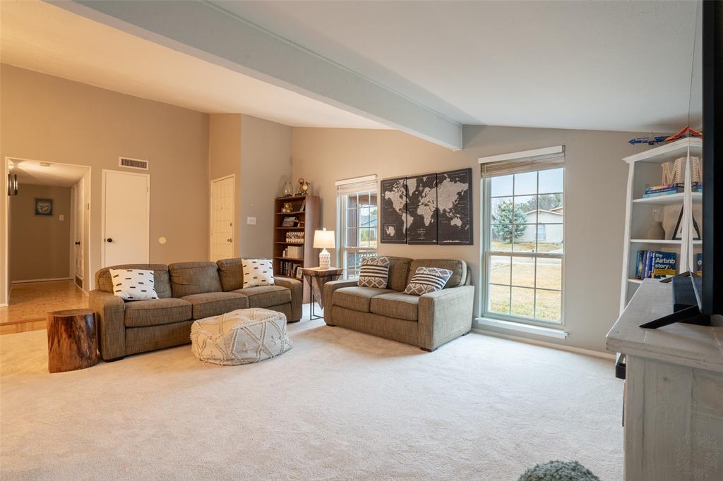 3124 Barton Road Carrollton, TX 75007 - Photo 9 of 36 a living room with furniture and a flat screen tv