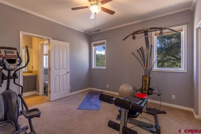 a livingroom with workspace and a window