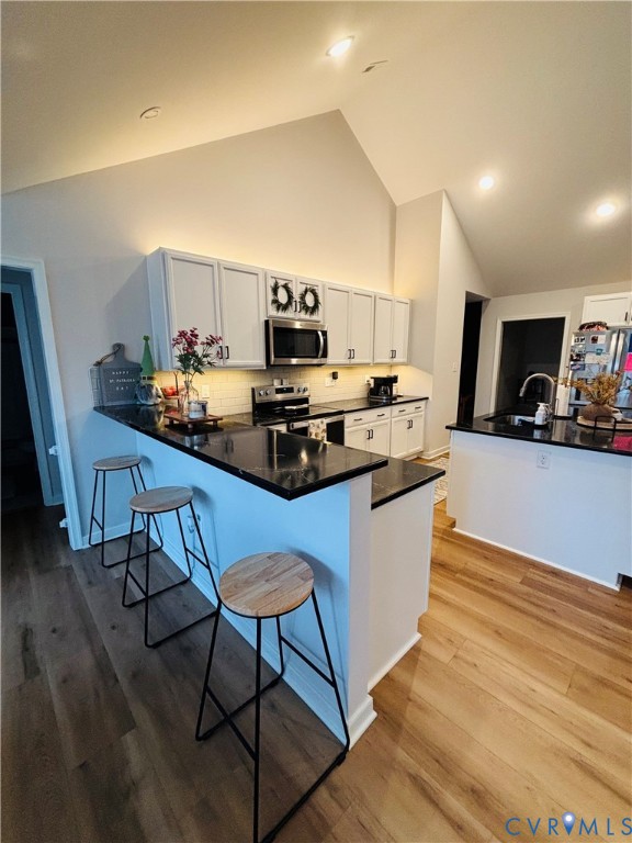 2211 Silver Street Aylett, VA 23009 - Photo 8 of 23 a kitchen with stainless steel appliances kitchen island granite countertop a sink and cabinets