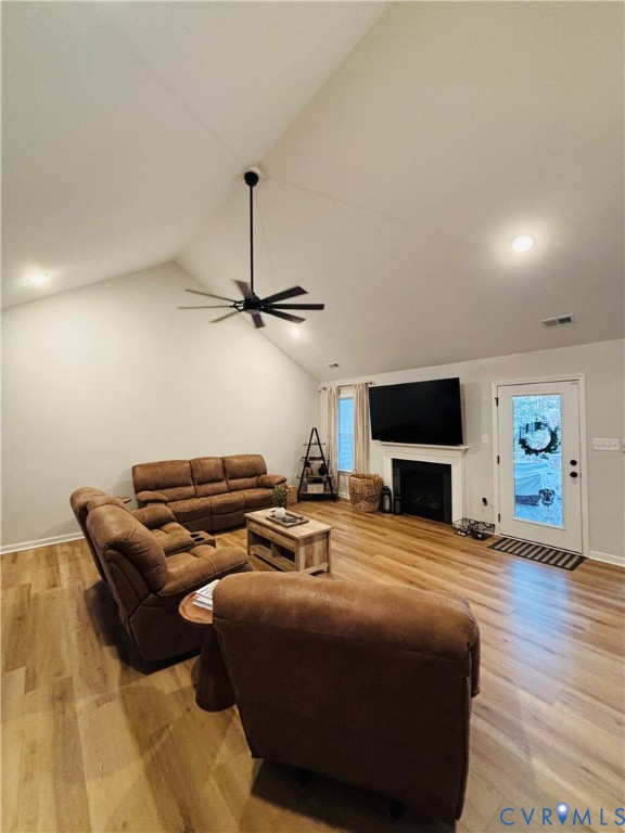2211 Silver Street Aylett, VA 23009 - Photo 10 of 23 a living room with furniture a flat screen tv and a fireplace