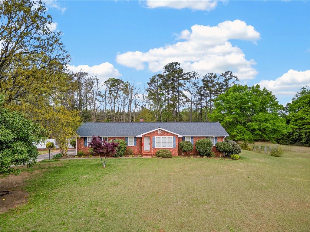 160 Burdette Circle Pendleton, SC 29670 - Photo 3 of 38 This charming brick home offers a peaceful retreat with its expansive yard and mature landscaping.