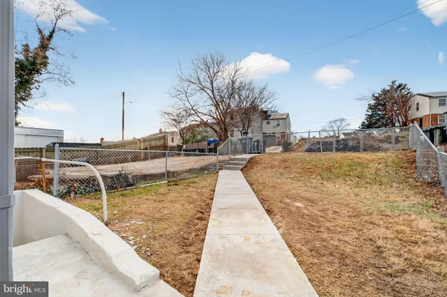 a view of swimming pool with outdoor seating and plants