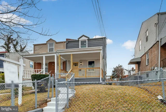a front view of a house with swimming pool