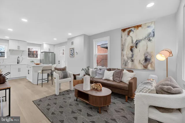 a living room with furniture and a rug