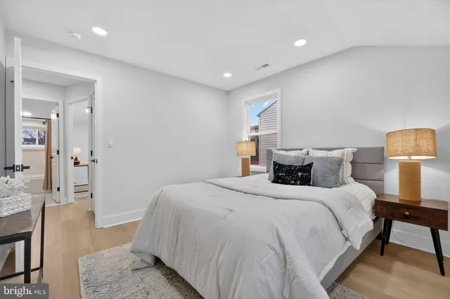 a bedroom with a bed and walk in closet