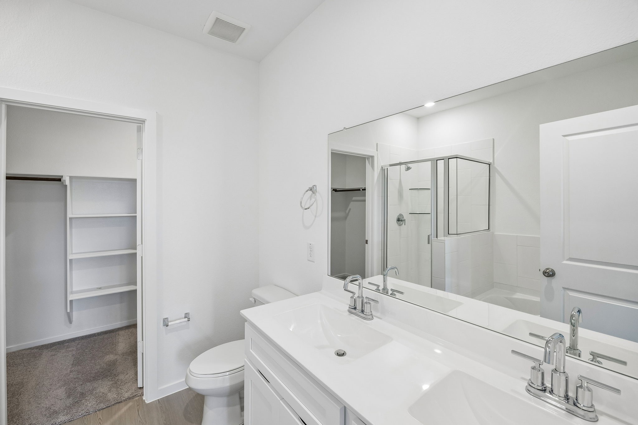 15015 Rustic Moon Road Conroe, TX 77302 - Photo 11 of 34 a bathroom with a sink a toilet and shower