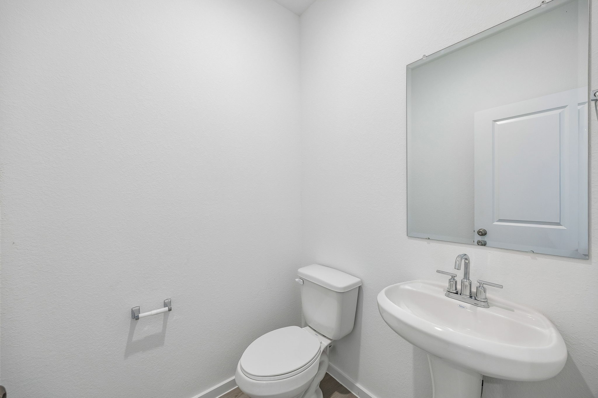 15015 Rustic Moon Road Conroe, TX 77302 - Photo 15 of 34 a bathroom with a toilet a sink and mirror