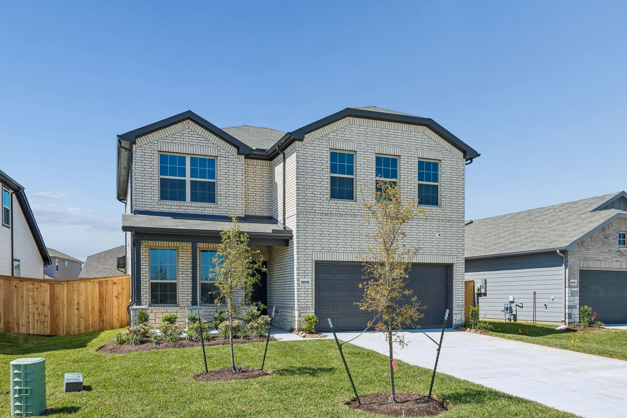 15015 Rustic Moon Road Conroe, TX 77302 - Photo 2 of 34 a front view of a house with a yard