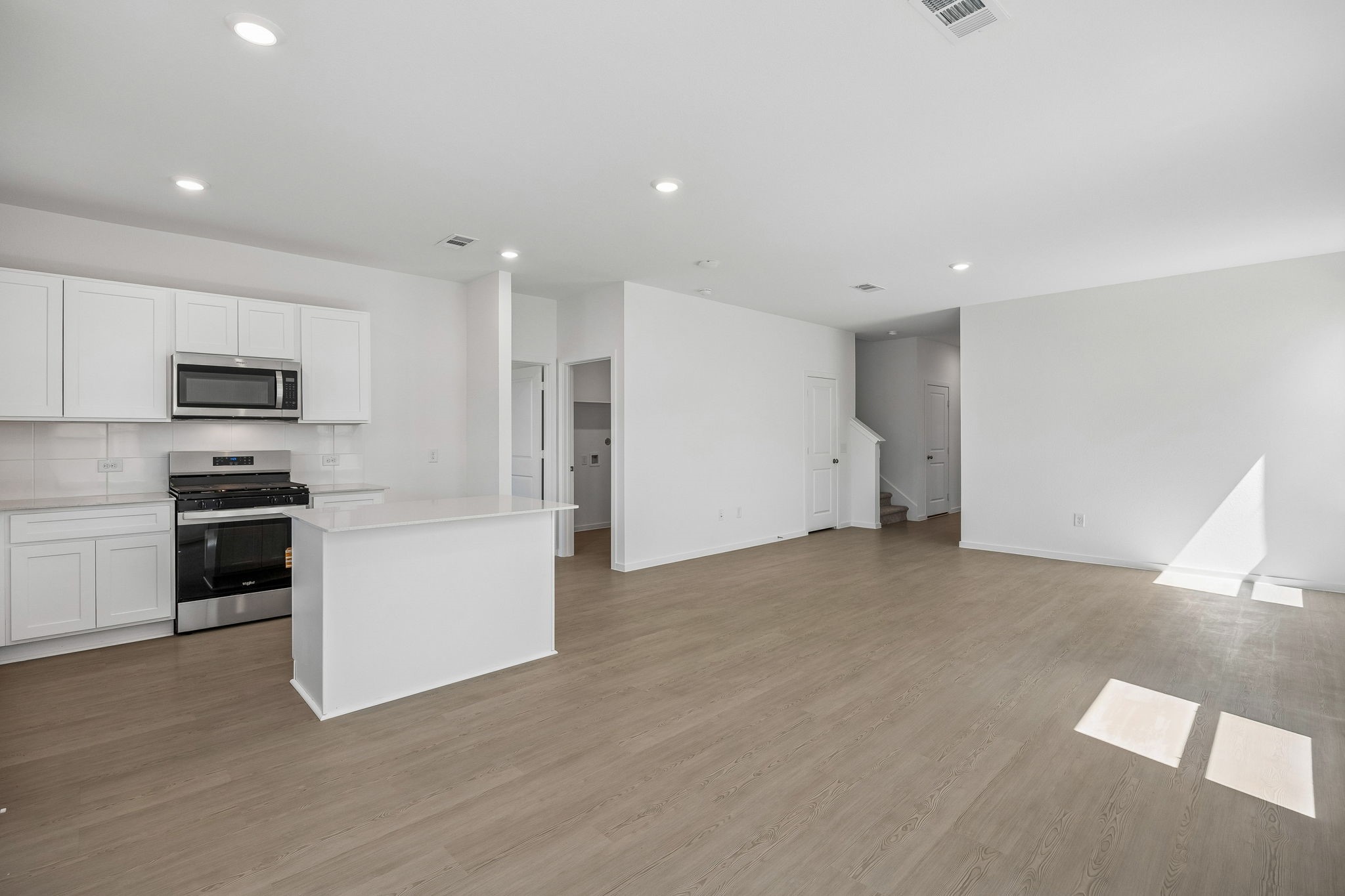 15015 Rustic Moon Road Conroe, TX 77302 - Photo 25 of 34 a view of a kitchen with a sink stove and refrigerator