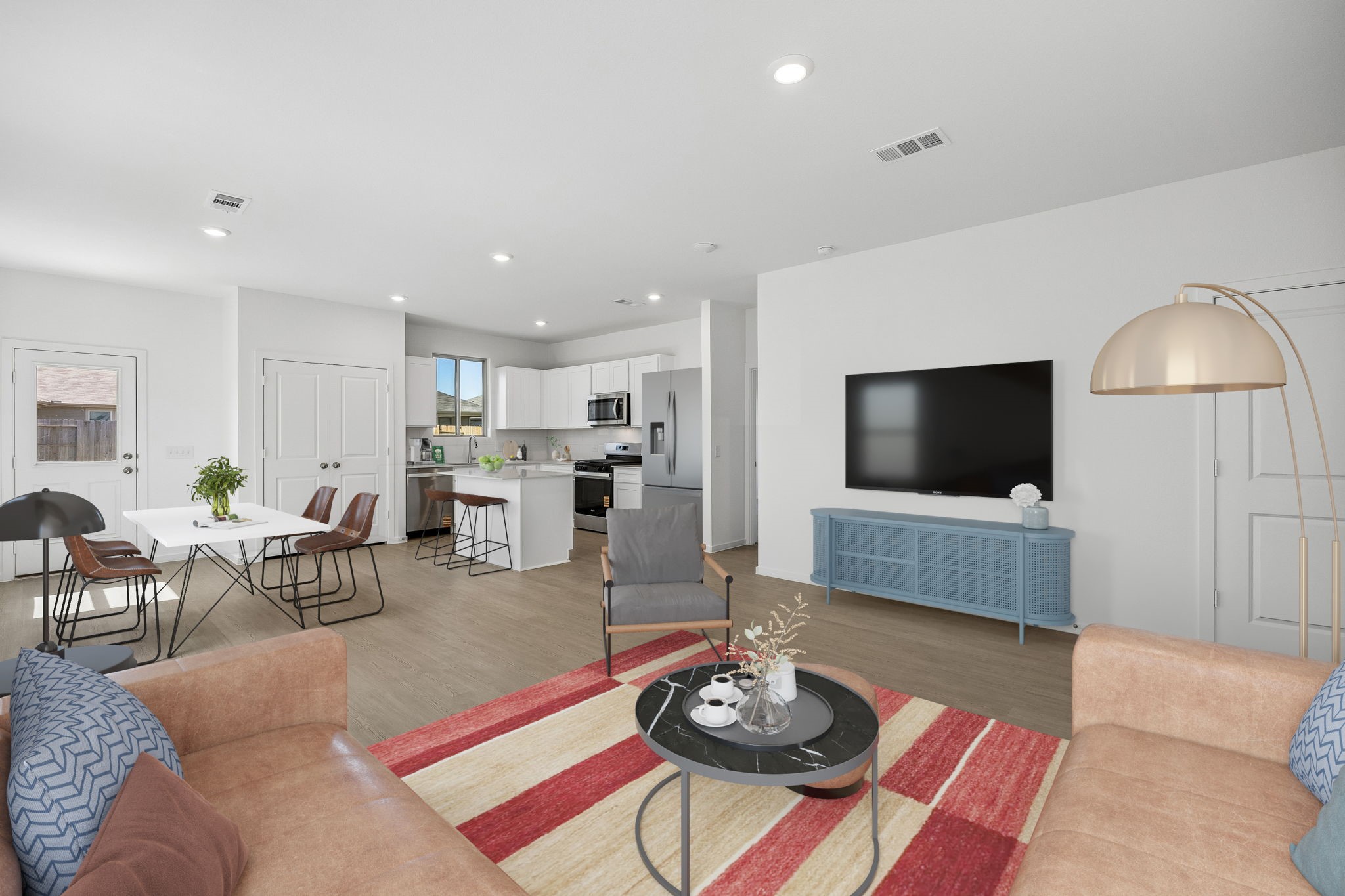 15015 Rustic Moon Road Conroe, TX 77302 - Photo 30 of 34 a living room with furniture a rug and a flat screen tv