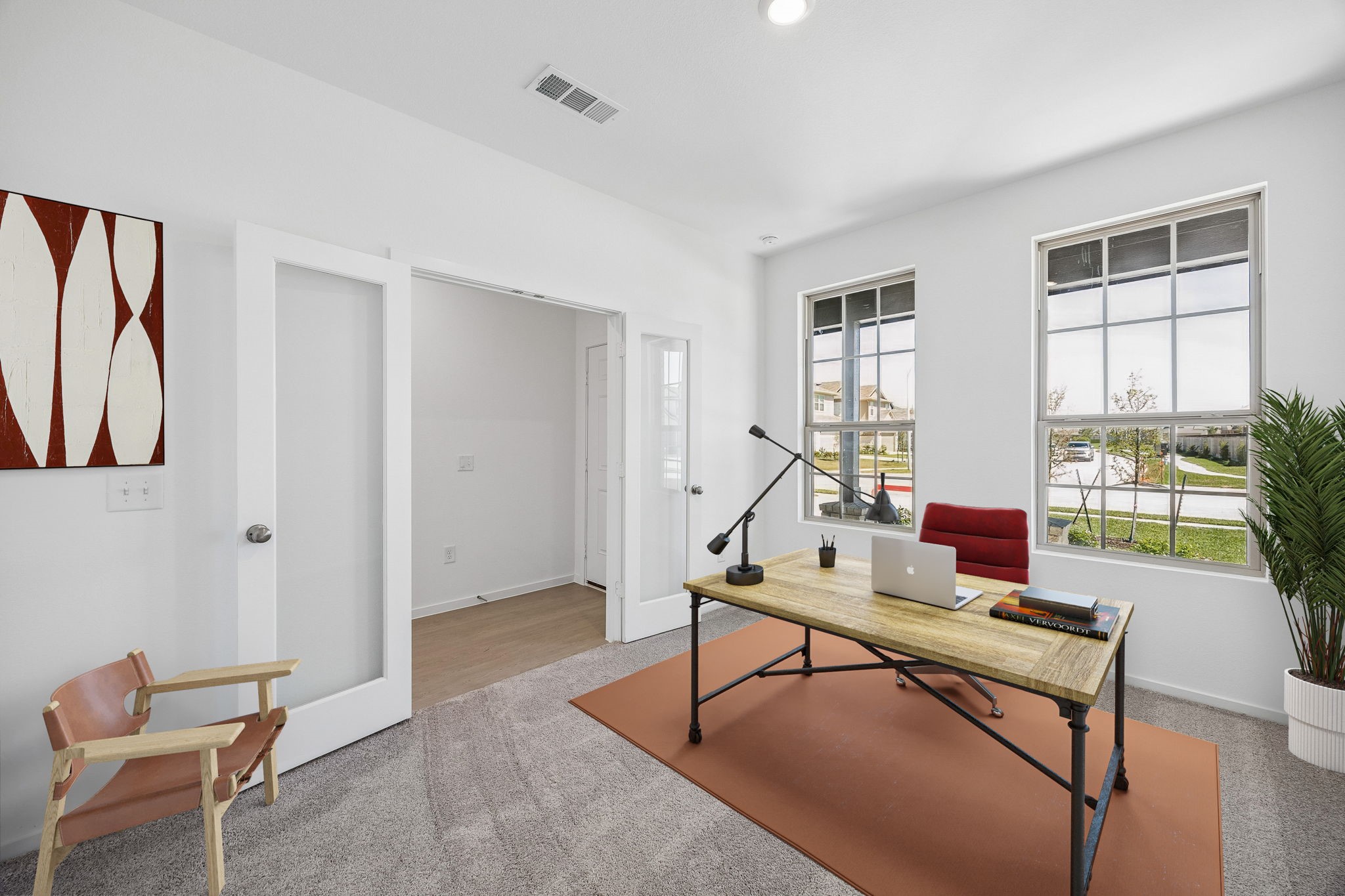 15015 Rustic Moon Road Conroe, TX 77302 - Photo 33 of 34 a living room with furniture a rug and a window