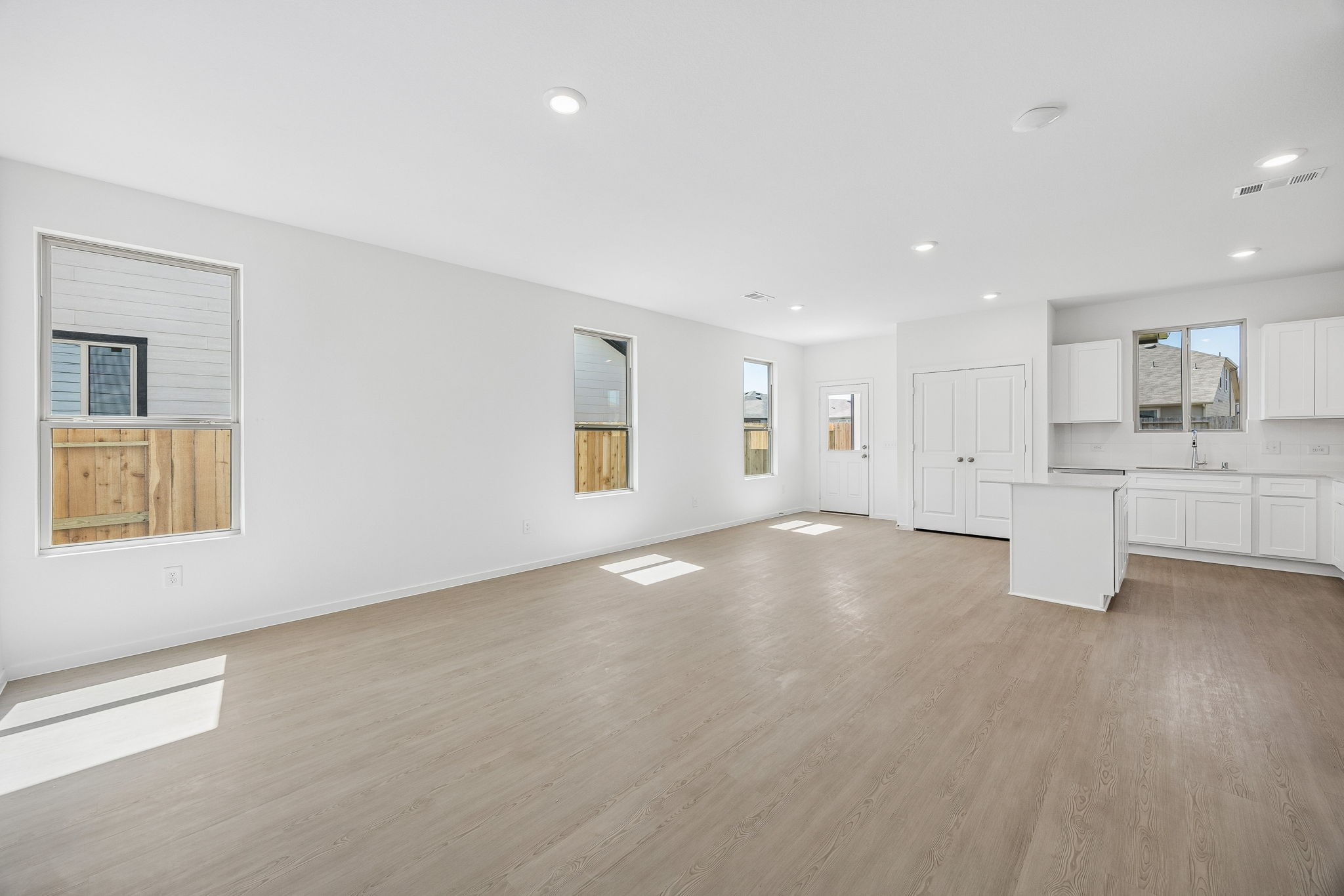 15015 Rustic Moon Road Conroe, TX 77302 - Photo 4 of 34 a view of an empty room with a kitchen