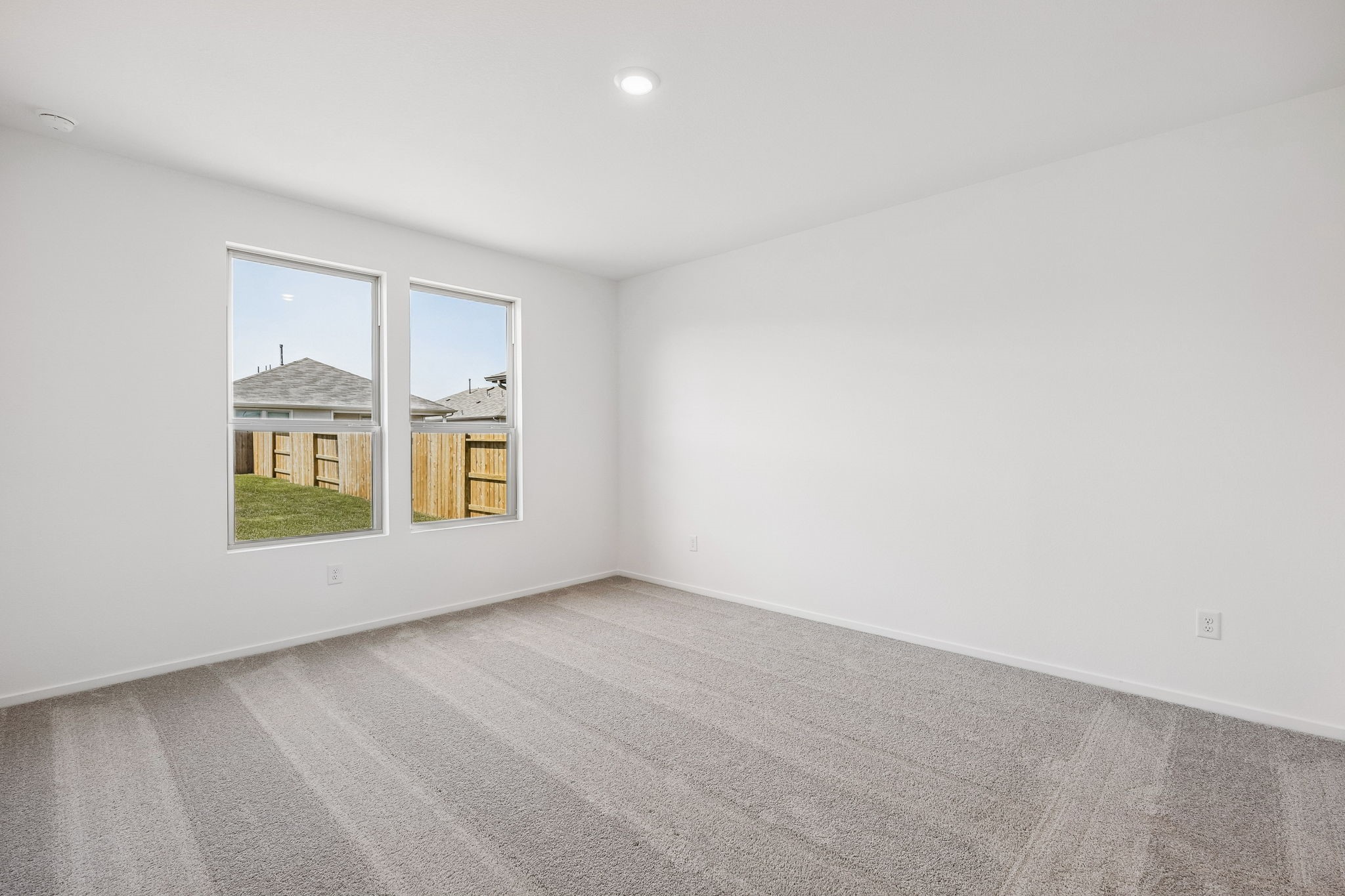 15015 Rustic Moon Road Conroe, TX 77302 - Photo 9 of 34 an empty room with windows