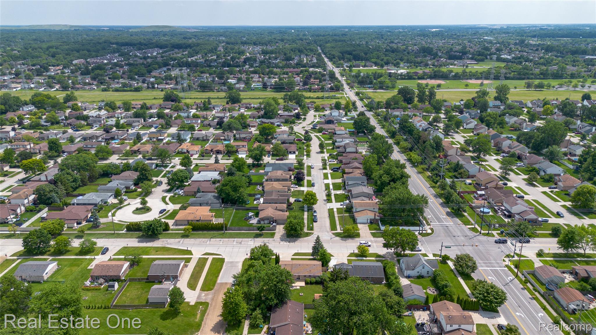 44220 Saltz Road Canton, MI 48187 - Photo 29 of 31 Expansive residential area featuring numerous single-family homes, mature tree-lined streets, and multiple paved roadways