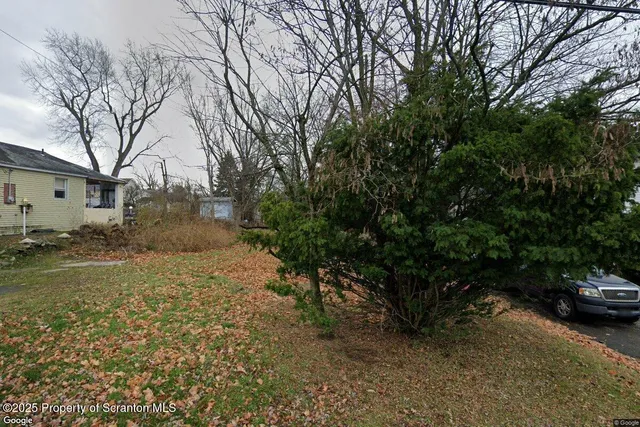a view of a street with a parked cars
