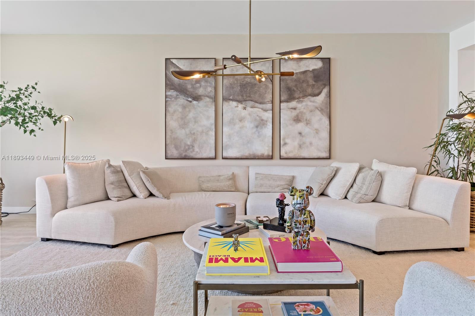 1135 103rd Street, Unit PH2 Bay Harbor Islands, FL 33154 - Photo 12 of 20 a living room with furniture and a couch