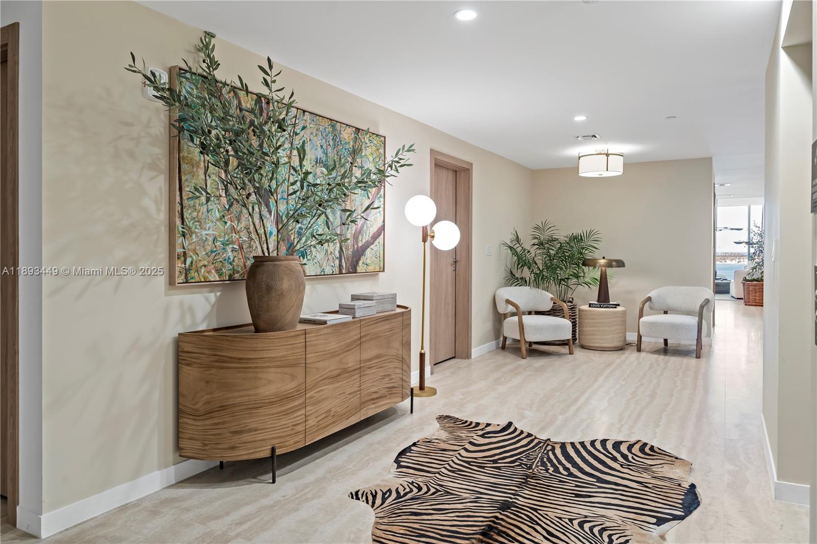 1135 103rd Street, Unit PH2 Bay Harbor Islands, FL 33154 - Photo 13 of 20 a living room with furniture and a potted plant