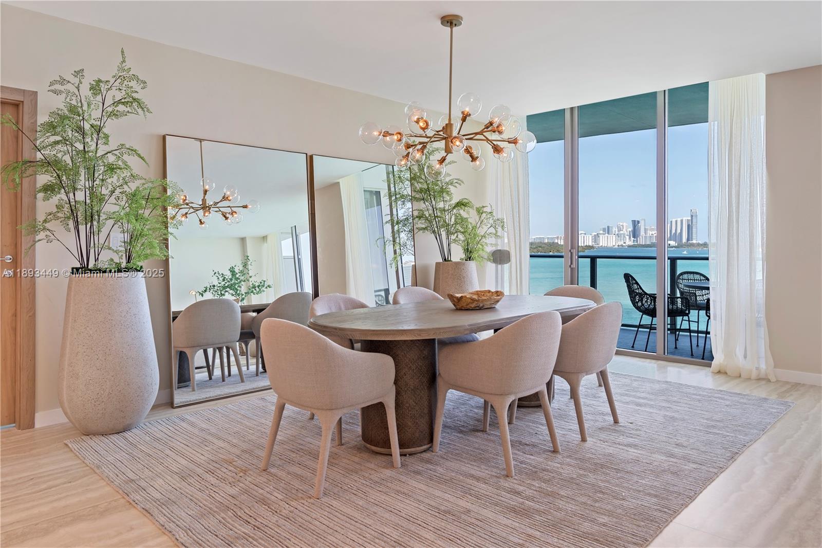 1135 103rd Street, Unit PH2 Bay Harbor Islands, FL 33154 - Photo 4 of 20 a view of a dining room with furniture window and wooden floor
