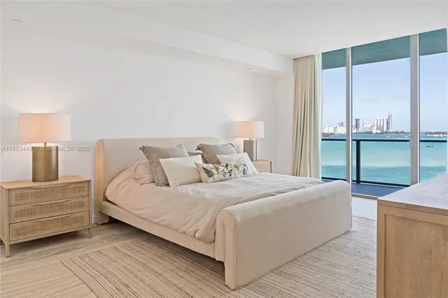 a bedroom with a bed and a table