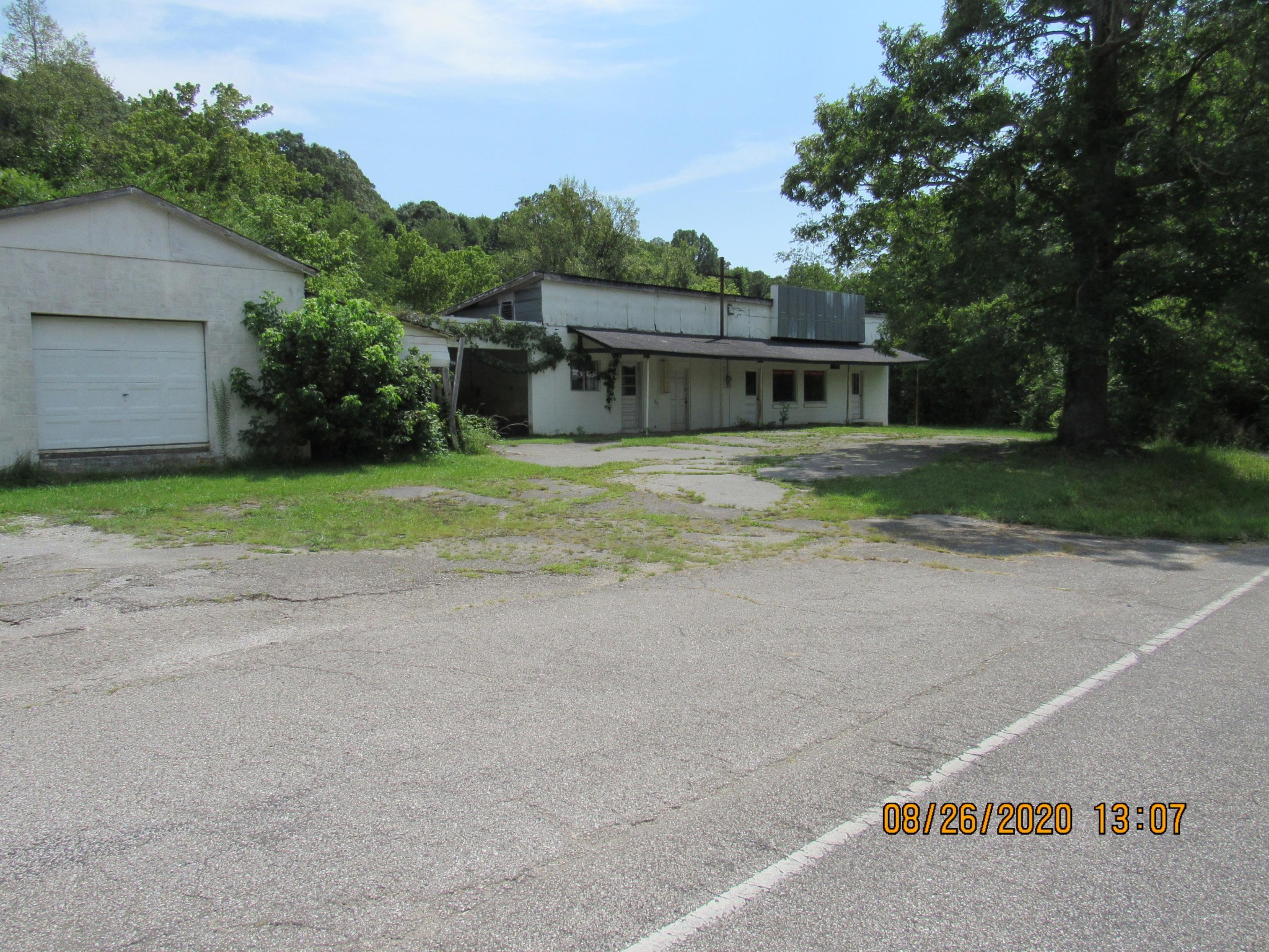 0 Spring Street Lancing, TN 37770 - Photo 1 of 19 a view of a house with a yard and large trees