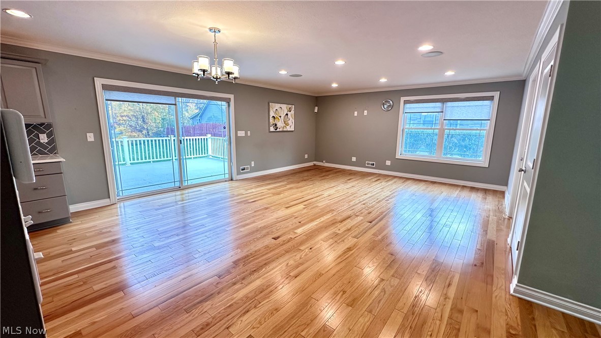 2603 Rockefeller Road Wickliffe, OH 44092 - Photo 10 of 34 Expansive living area with wood-finish flooring, recessed lighting, and a modern chandelier
