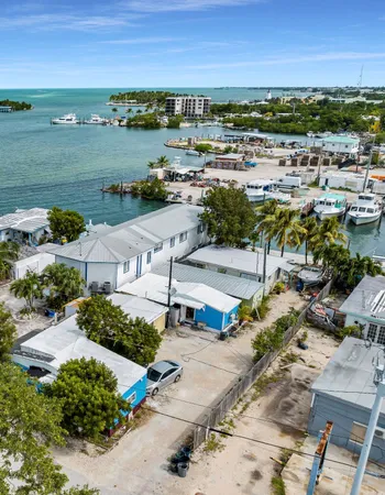 an aerial view of a house with a lake view