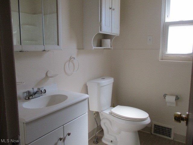 9809 Alexander Road Garfield Heights, OH 44125 - Photo 11 of 17 Bathroom featuring toilet and vanity