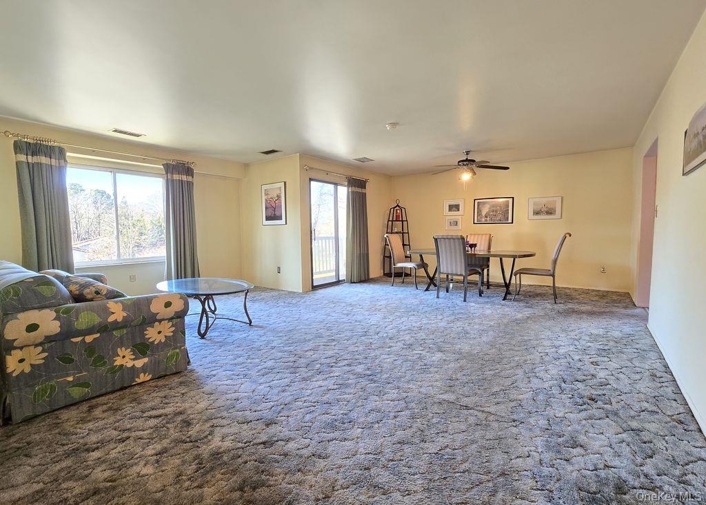 79 Birchwood Road Coram, NY 11727 - Photo 3 of 12 a living room with furniture and a window