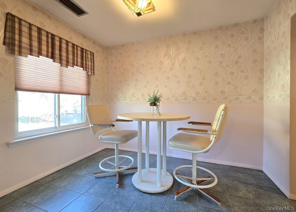 79 Birchwood Road Coram, NY 11727 - Photo 7 of 12 a view of a room with gym equipment