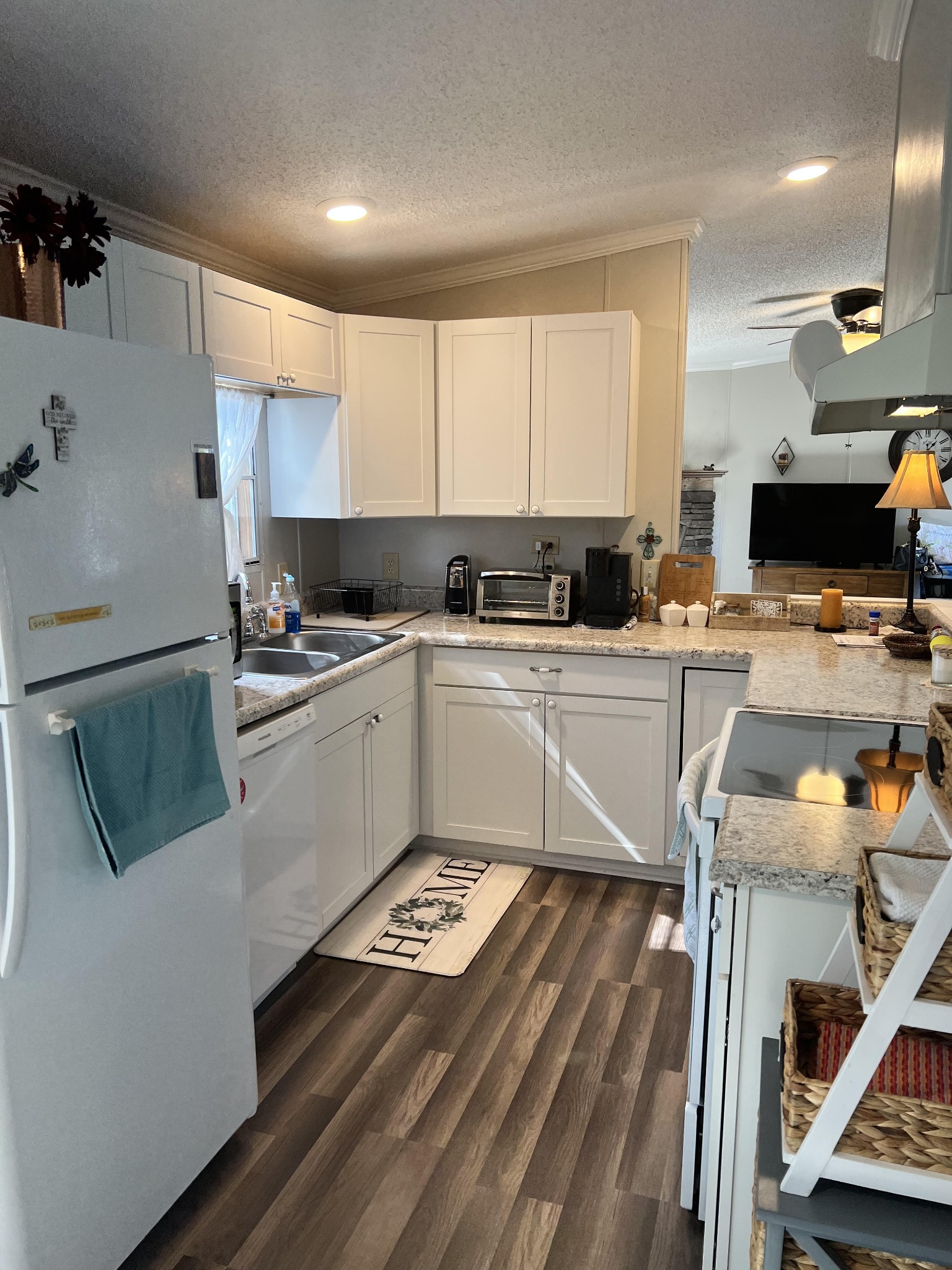 20002 Cessna Road Bon Aqua, TN 37025 - Photo 14 of 28 a kitchen with a sink appliances and cabinets