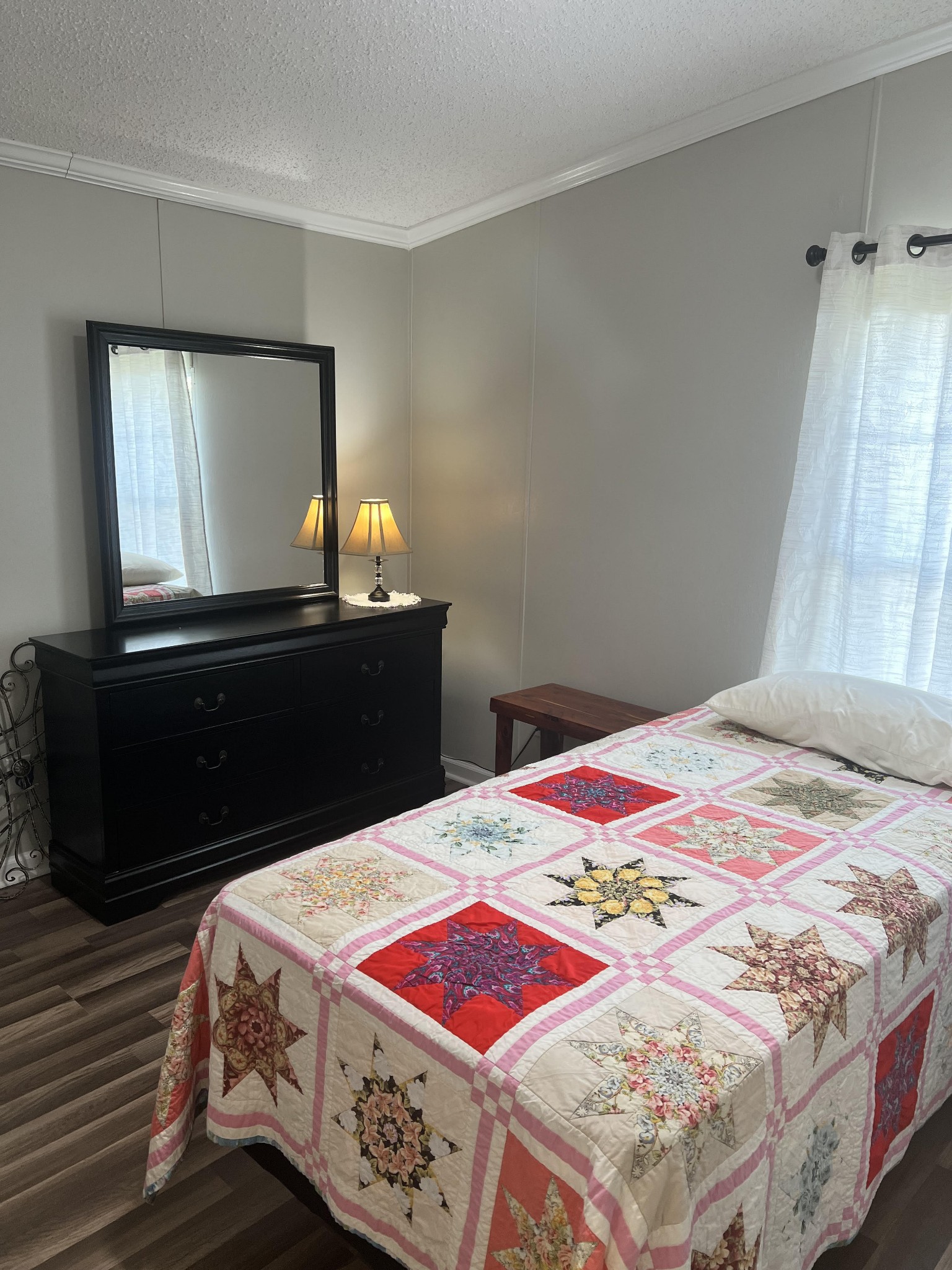 20002 Cessna Road Bon Aqua, TN 37025 - Photo 24 of 28 a bedroom with a bed and a dresser