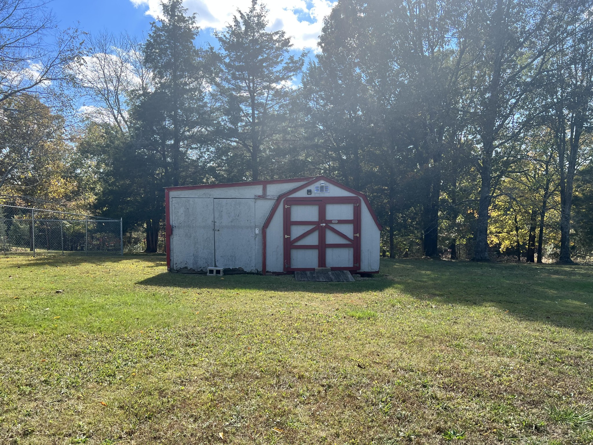 20002 Cessna Road Bon Aqua, TN 37025 - Photo 26 of 28 a view of a couches in a yard with large trees