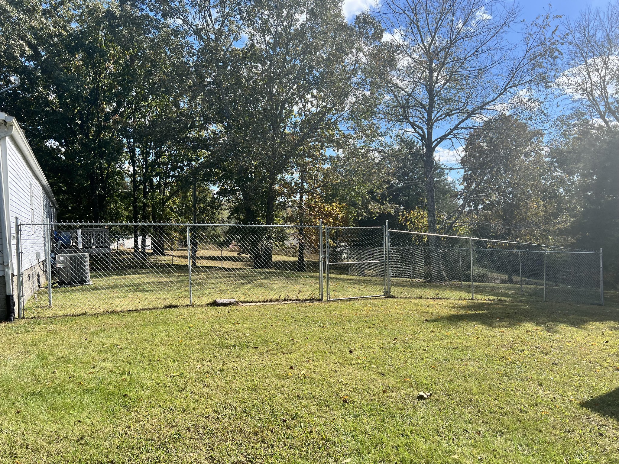 20002 Cessna Road Bon Aqua, TN 37025 - Photo 27 of 28 a view of a swimming pool with a yard and large trees