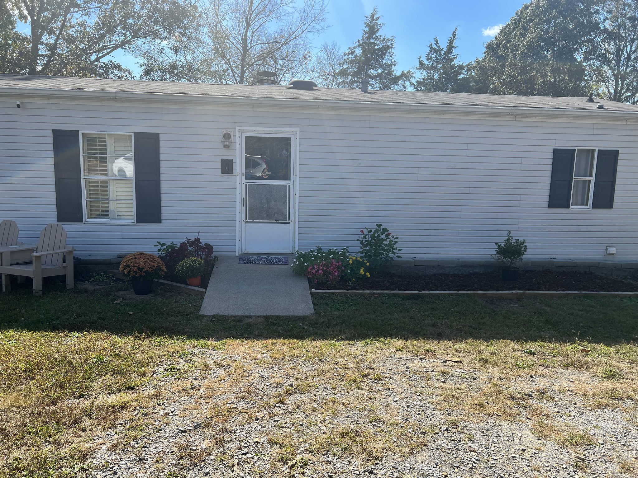 20002 Cessna Road Bon Aqua, TN 37025 - Photo 3 of 28 a view of a backyard with plants and large tree