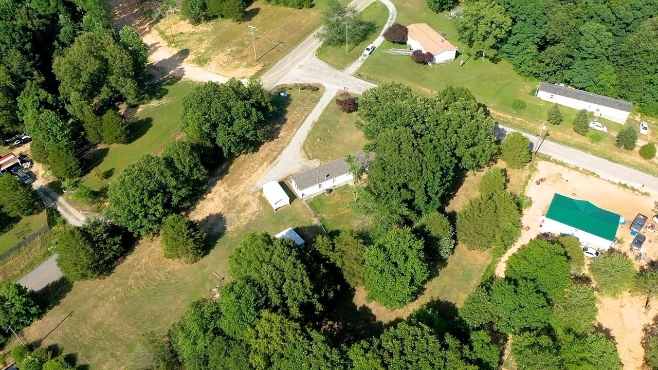 20002 Cessna Road Bon Aqua, TN 37025 - Photo 6 of 28 an aerial view of residential house with swimming pool and garden