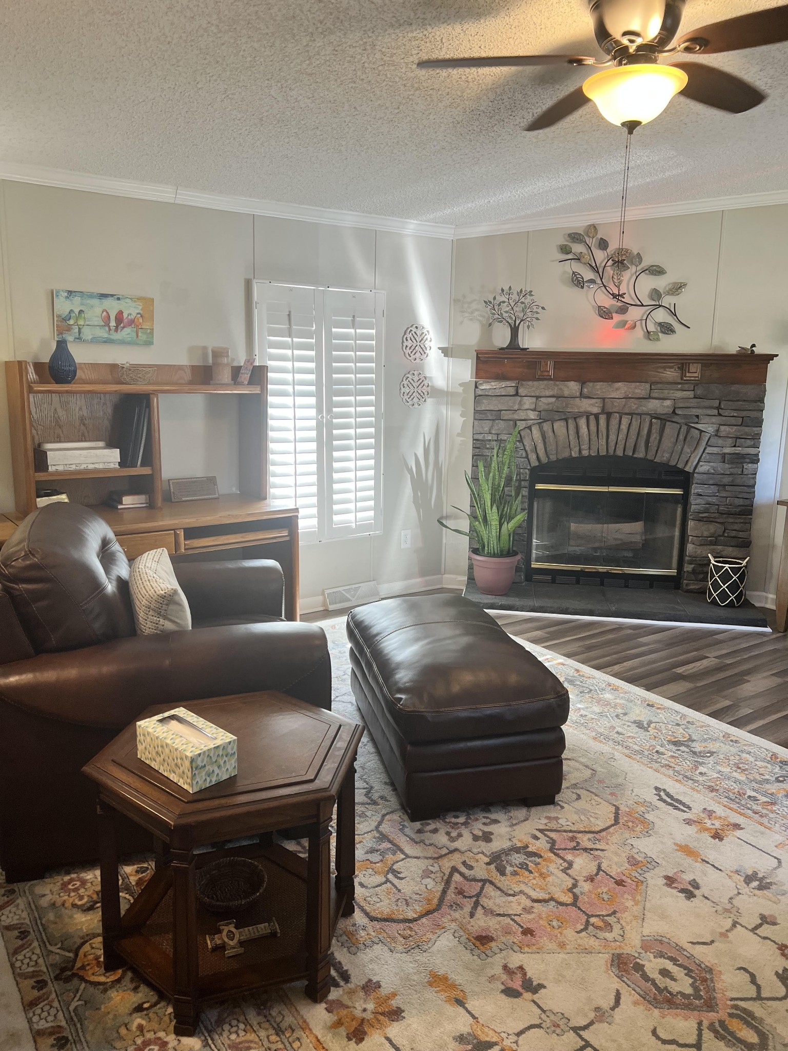 20002 Cessna Road Bon Aqua, TN 37025 - Photo 7 of 28 a living room with furniture a fireplace and a chandelier
