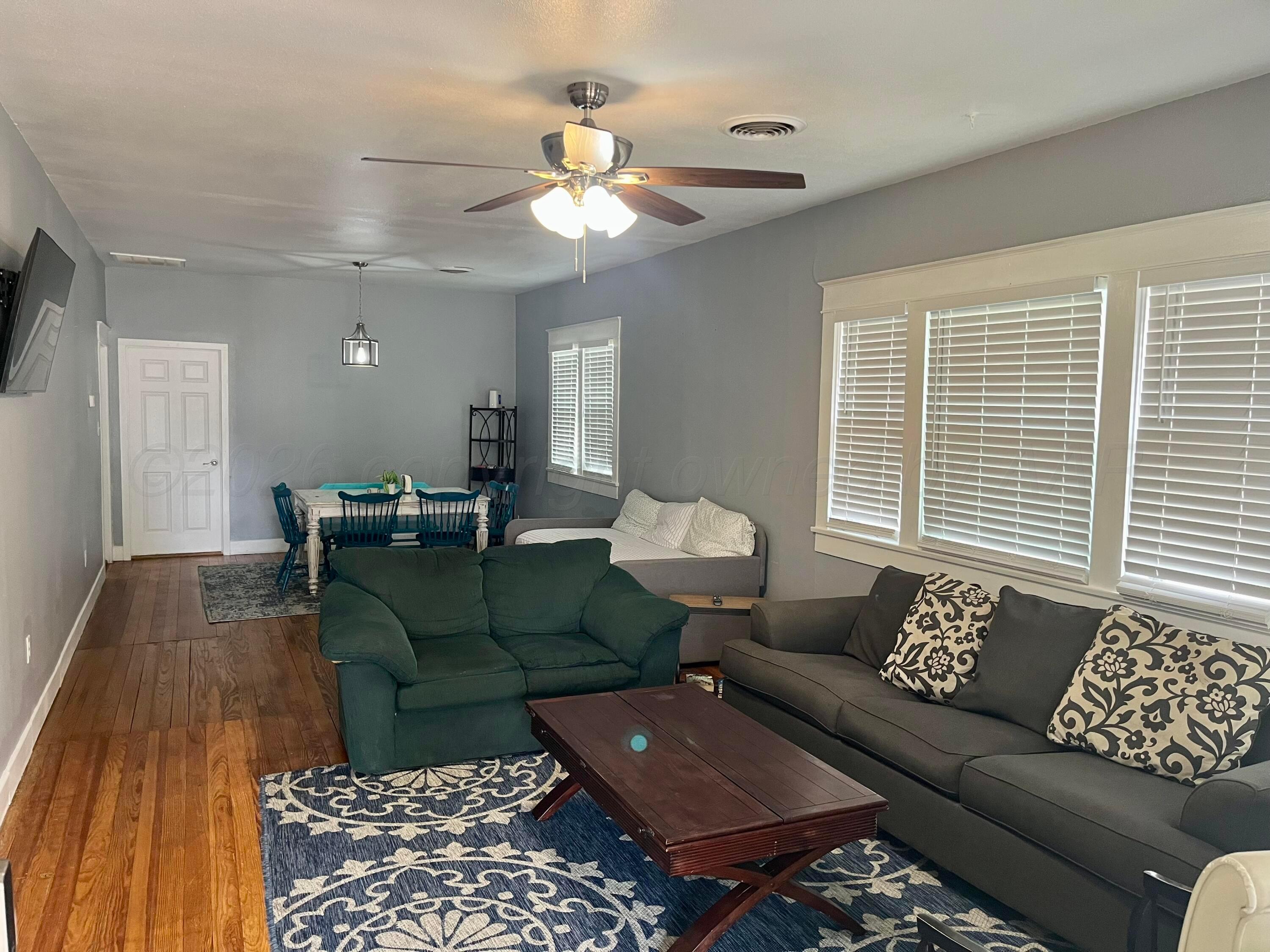 2011 5th Avenue Canyon, TX 79015 - Photo 2 of 12 a living room with furniture and a large window