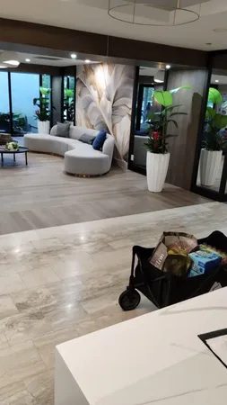 a living room with furniture and potted plant