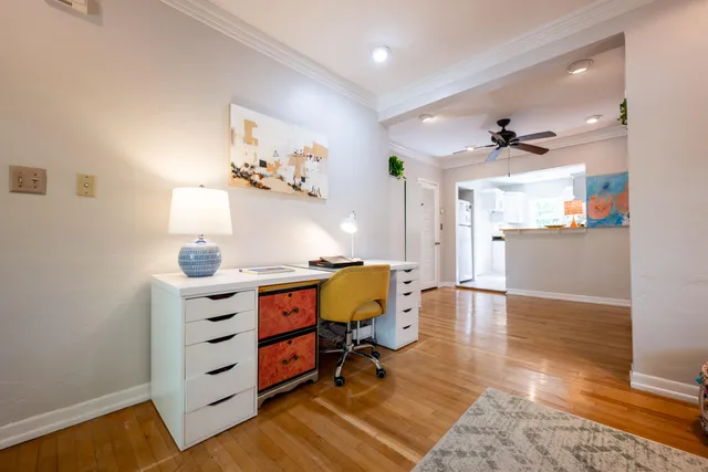 a view of workspace with furniture and wooden floor