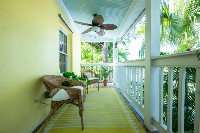 a balcony with chairs