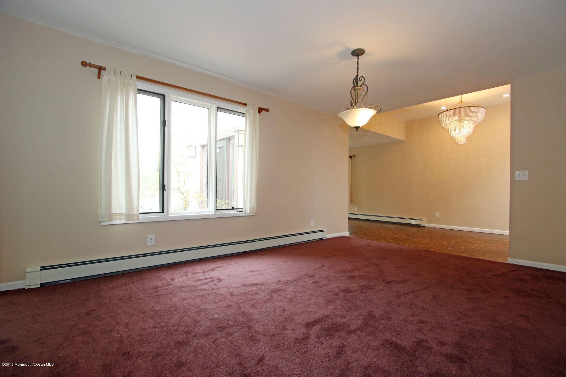 186 Pinebrook Road Tinton Falls, NJ 07724 - Photo 24 of 41 an empty room with windows and entrance