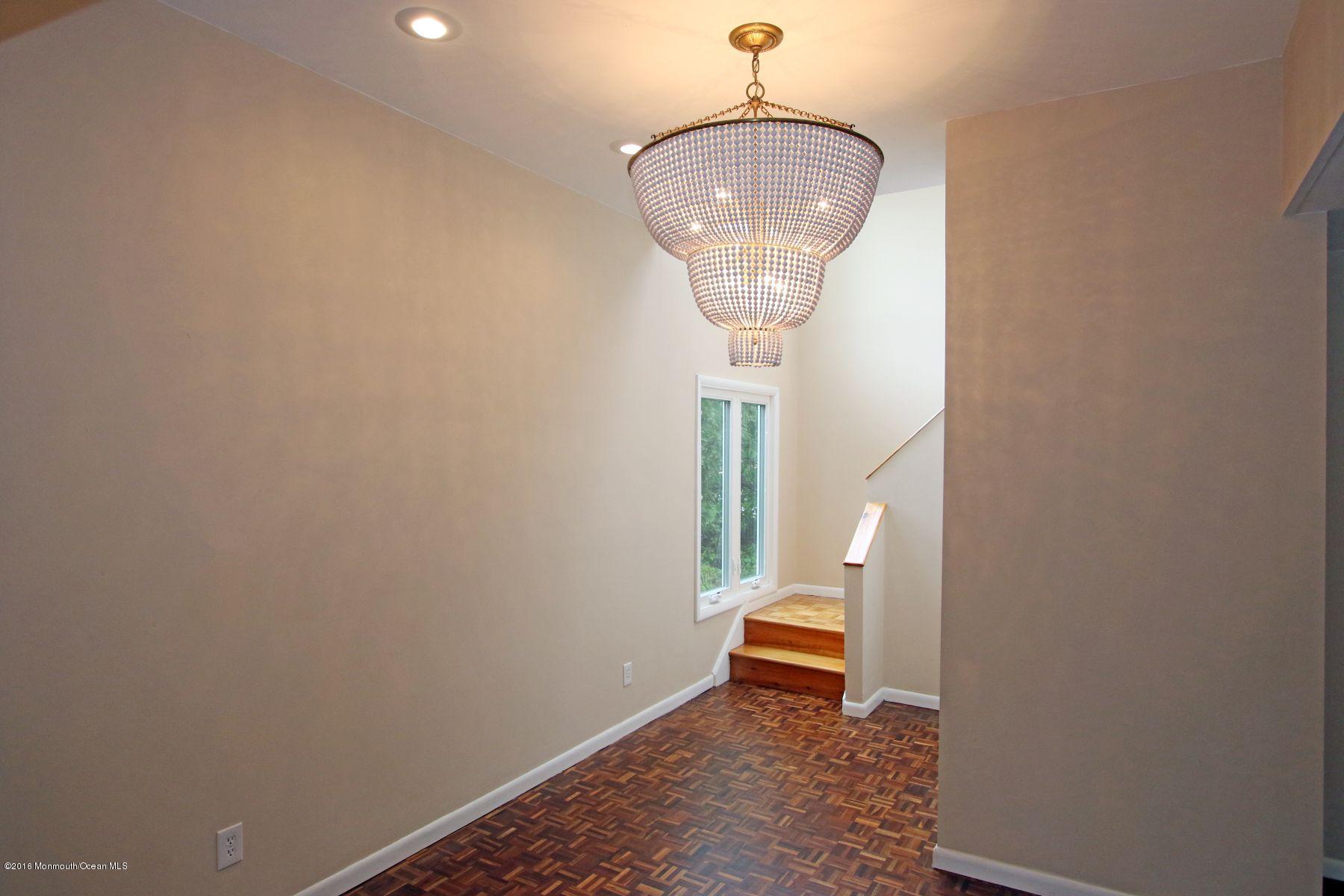 186 Pinebrook Road Tinton Falls, NJ 07724 - Photo 25 of 41 a room with wooden floor