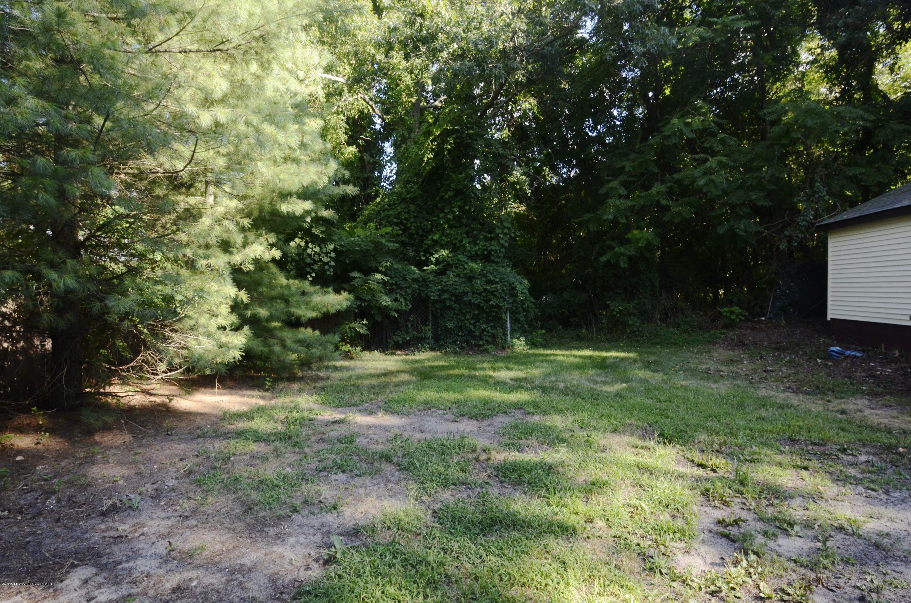 186 Pinebrook Road Tinton Falls, NJ 07724 - Photo 3 of 41 a view of a yard with a trees