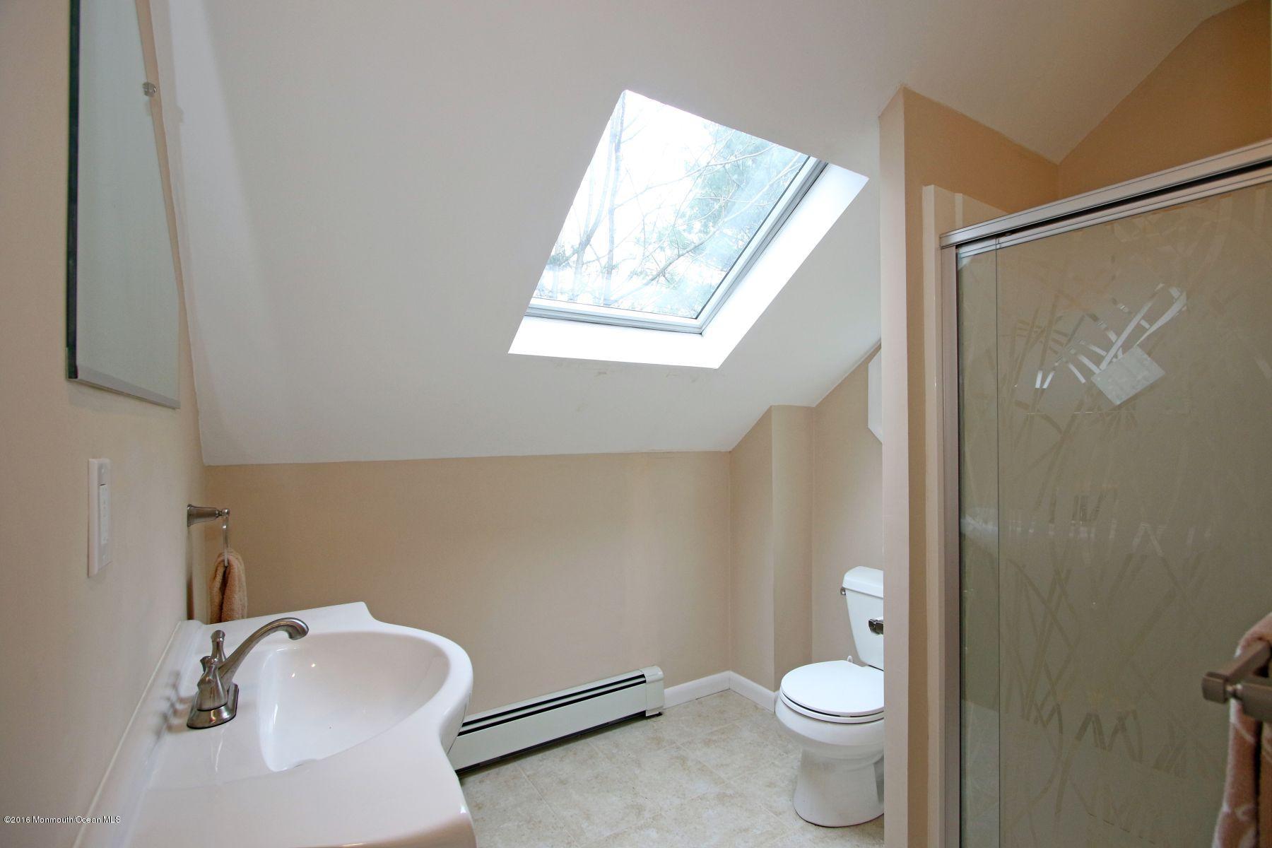 186 Pinebrook Road Tinton Falls, NJ 07724 - Photo 33 of 41 a bathroom with a granite countertop toilet and a sink