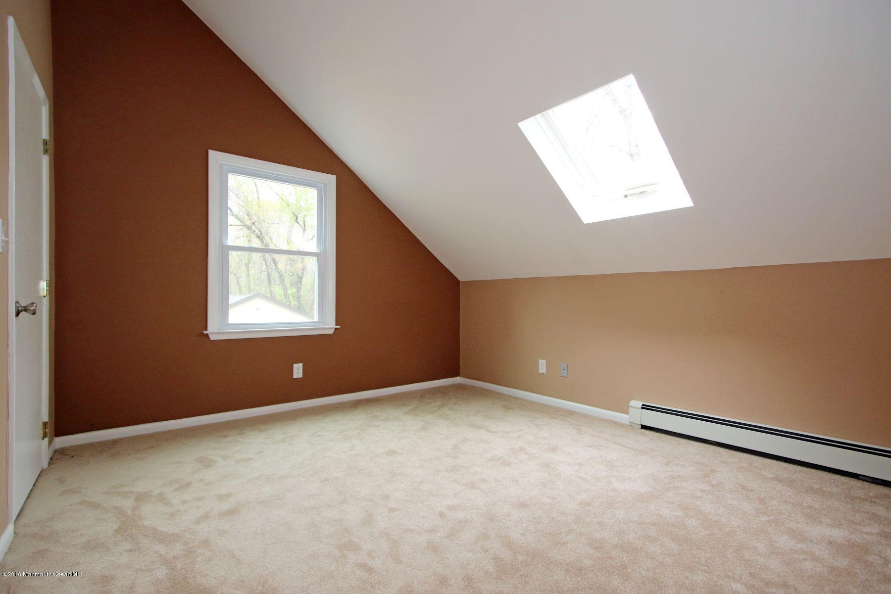 186 Pinebrook Road Tinton Falls, NJ 07724 - Photo 39 of 41 an empty room with windows