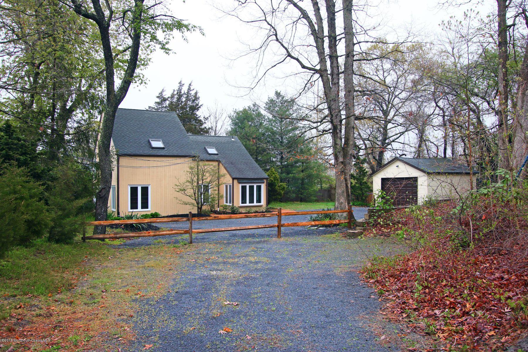 186 Pinebrook Road Tinton Falls, NJ 07724 - Photo 4 of 41 a view of a house with a yard