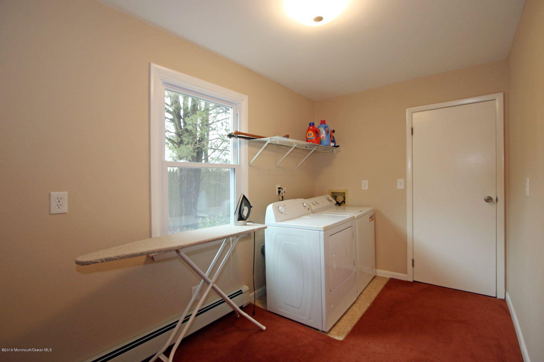 186 Pinebrook Road Tinton Falls, NJ 07724 - Photo 41 of 41 a utility room with dryer and washer