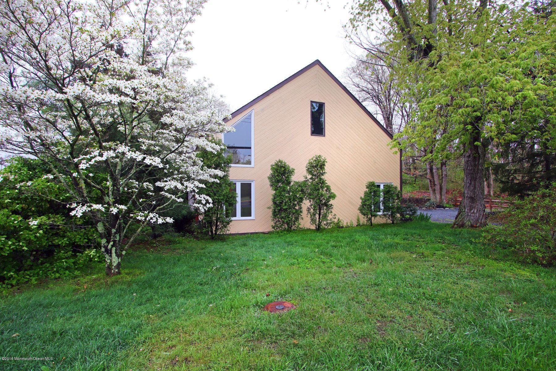 186 Pinebrook Road Tinton Falls, NJ 07724 - Photo 6 of 41 a view of a house with backyard and garden
